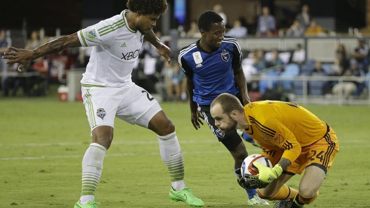 
Seattle Sounders central defender Roman Torres, left, with goalkeeper Stefan Frei and San Jose Earthquakes midfielder Cordell Cato during the first half of Saturday match at San Jose. 
