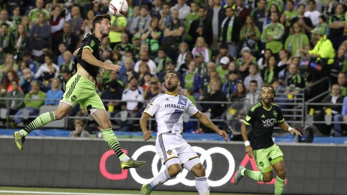 Seattle Sounders defender Brad Evans, left, in action for Sounders in game versus LA Galaxy.