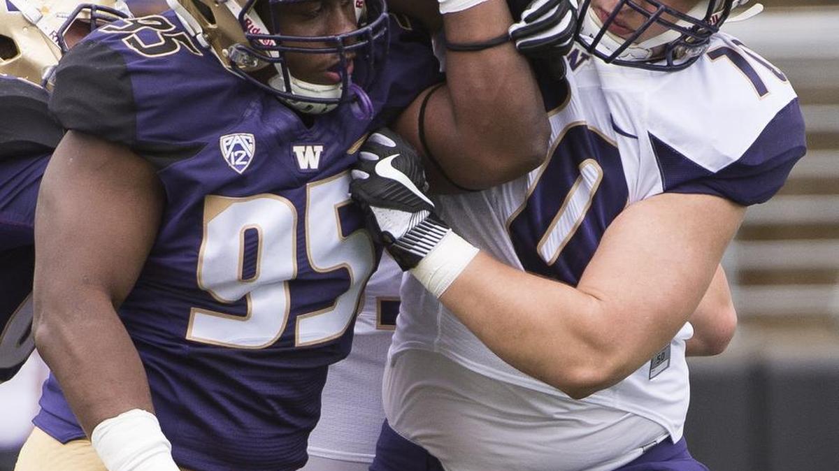 Washington defensive lineman Levi Onwuzurike (95) and Washington offensive lineman Jared Hilbers (70) participate in a drill at the University of Washington Spring Football Game at Husky Stadium in Seattle, Wash., on Saturday, April 22, 2017.