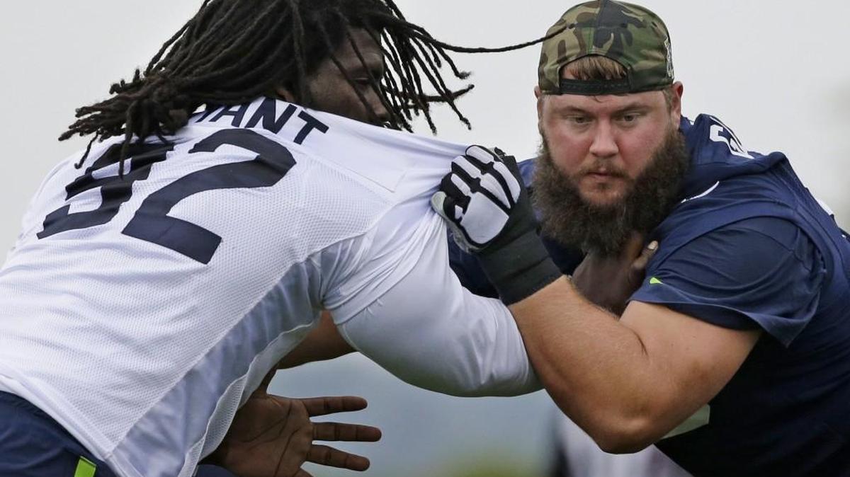 Seattle defensive tackle Brandin Bryant, left, blocks Mark Glowinski, right, Saturday during training camp in Renton. Bryant, who came to the Seahawks as an undrafted free agent, is trying to earn a roster spot.
