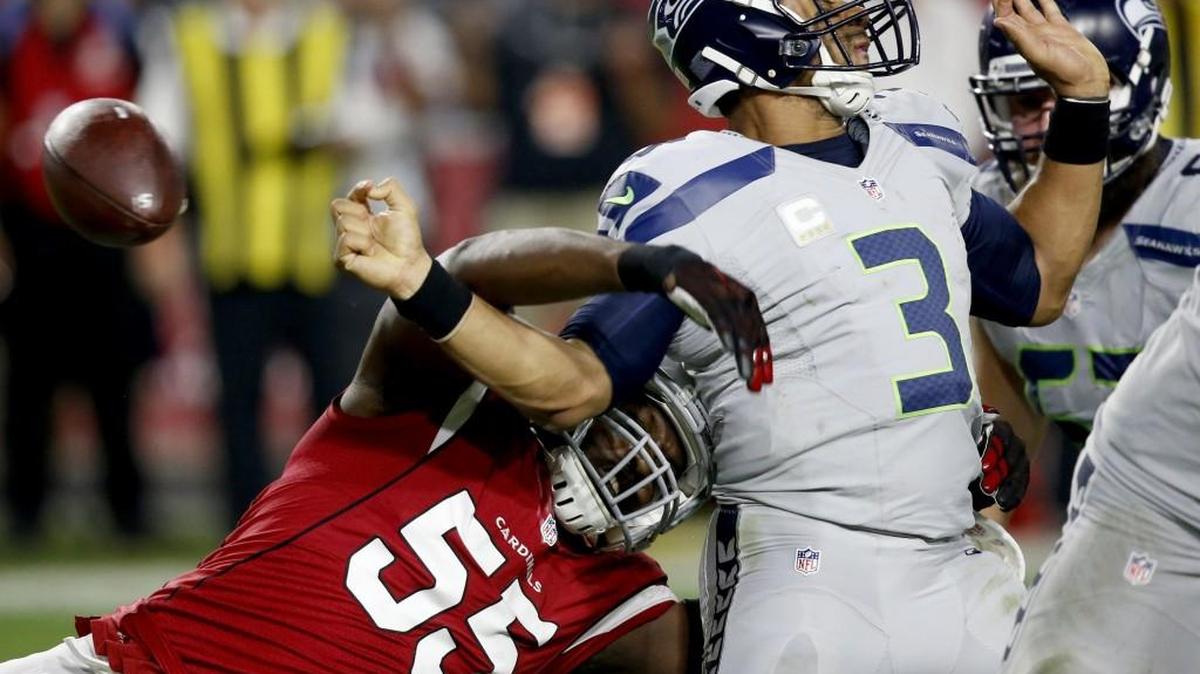 Arizona Cardinals outside linebacker Chandler Jones (55) forces Seattle Seahawks quarterback Russell Wilson (3) to fumble during a game that would end in a 6-6 tie on Oct. 23 in Glendale, Arizona.