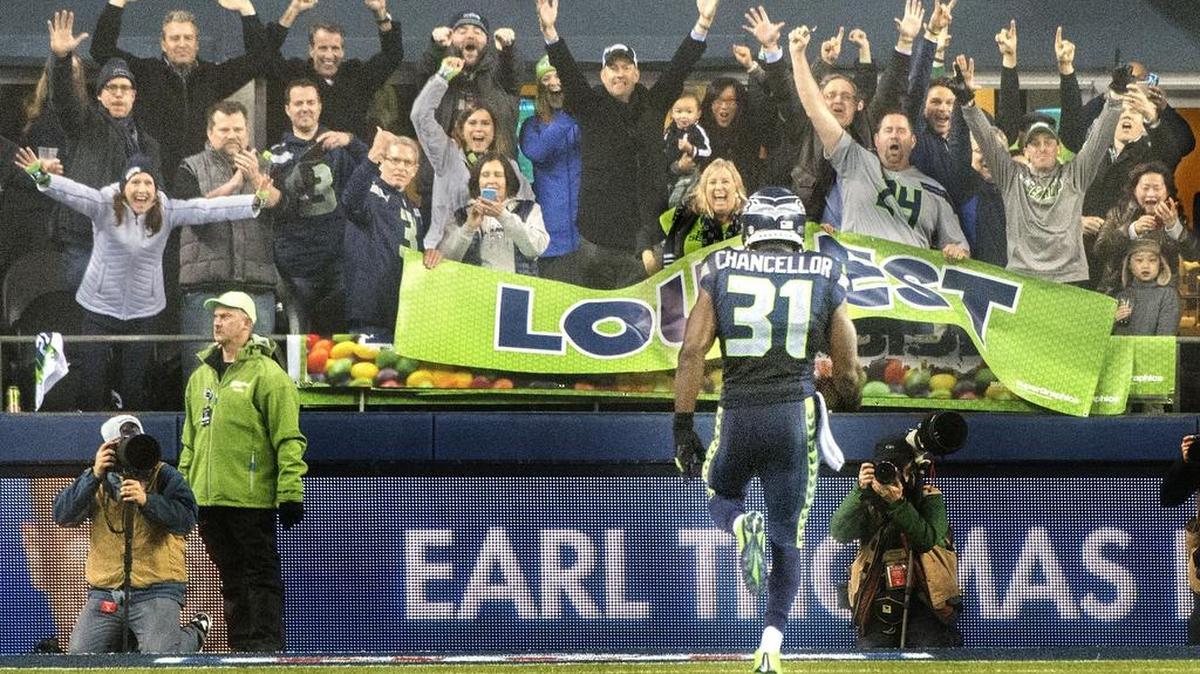 
Seahawks safety Kam Chancellor returns an interception for a touchdown Jan. 10 against Carolina in a NFC Divisional playoff in Seattle. Plays like this are why Chancellor is holding out of the team’s training camp in hopes of getting a lucrative new contract.
