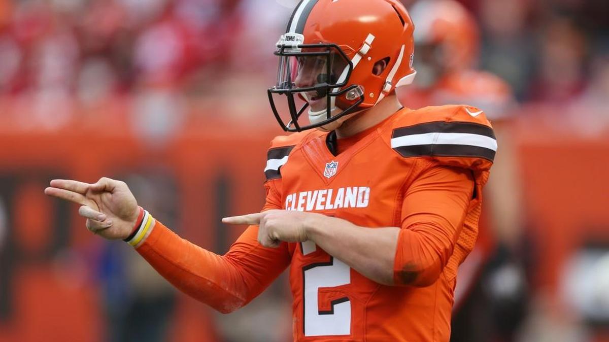 In this Dec. 13, 2015, file photo, Cleveland Browns quarterback Johnny Manziel (2) gestures during the first half of an NFL game against the San Francisco 49ers, in Cleveland. Russell Wilson has it all put together. Johnny Manziel has been nothing but chaos since entering the NFL. The two players with similar football skills meet for the first time on Sunday.