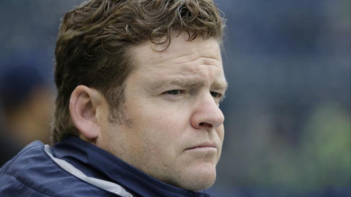 Seattle Seahawks general manager John Schneider watches warmups before an NFL football game against the Carolina Panthers.
