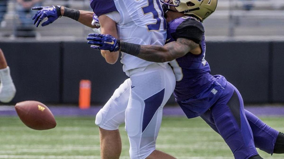 UW cornerback Kevin King, right, knocks the ball out of the hands of receiver Drew Before on Saturday. King appears on the cusp of Pac-12 stardom, Dave Boling says.
