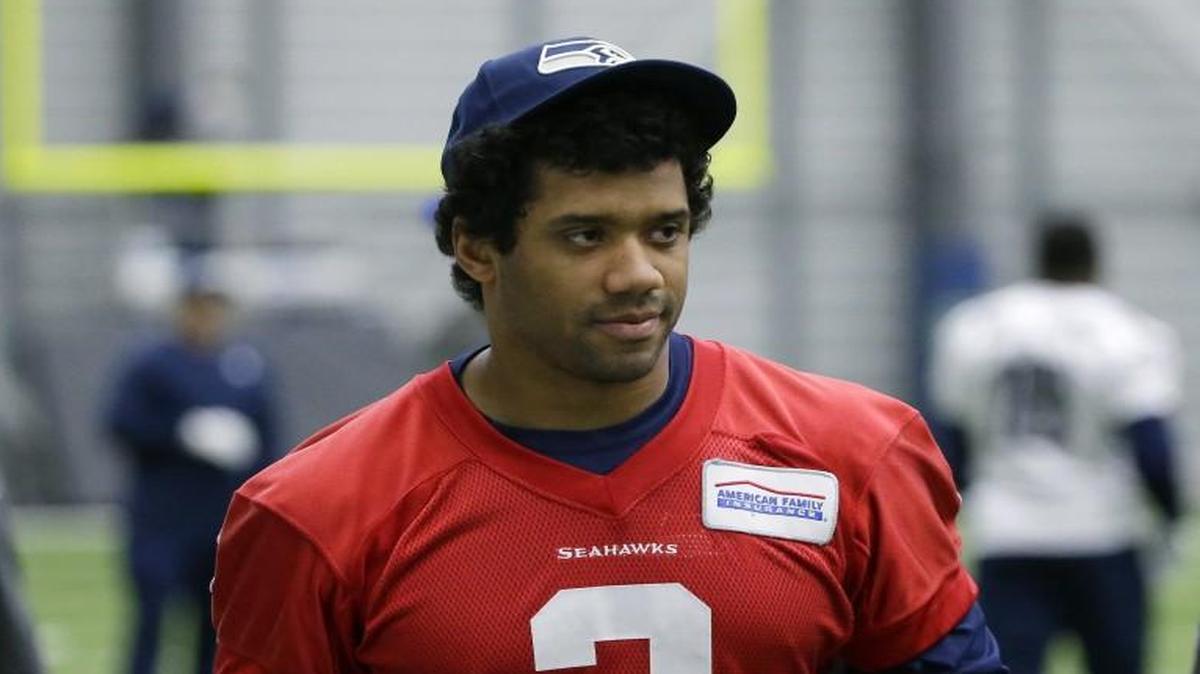 Seattle Seahawks quarterback Russell Wilson walks off the field after practice, Tuesday, Jan. 10, 2017, in Renton.