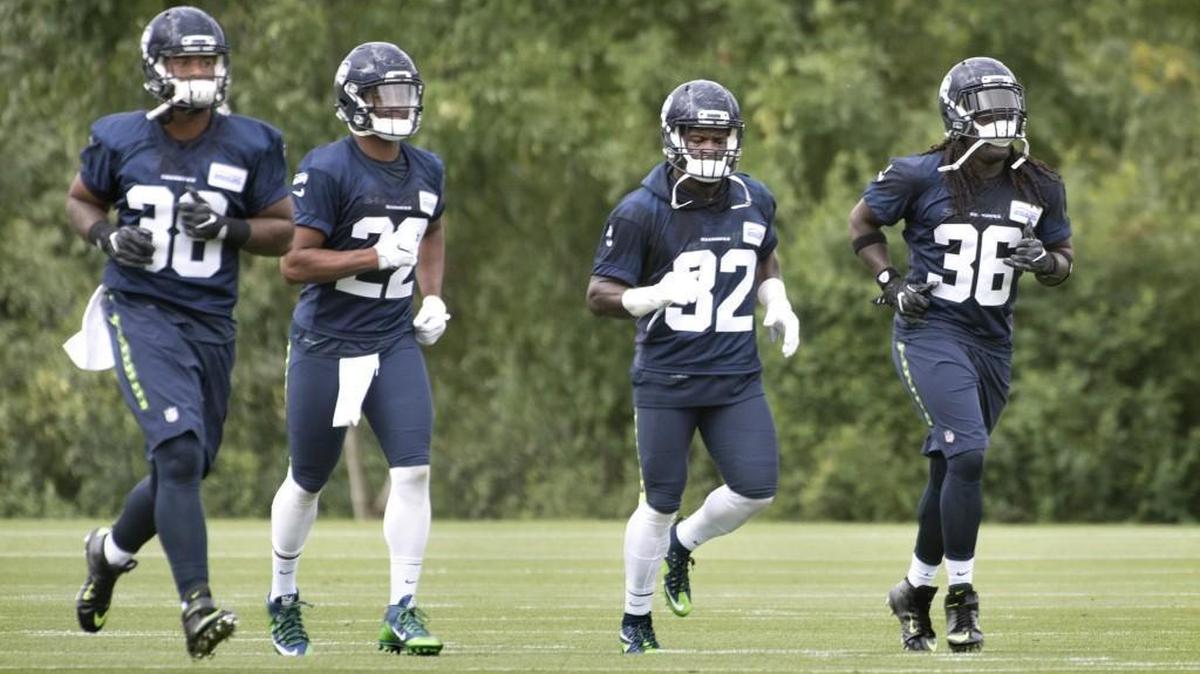 Seahawks rookie running backs Alex Collins (36) and C.J. Prosise (22) have been impressive in the early days of training camp. Also pictured: Tre Madden (38) and Christine Michael (32).