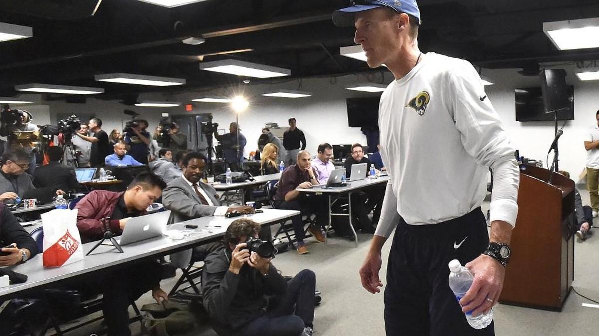 Los Angeles Rams interim head coach John Fassel leaves after addressing the media at the team's training facility at California Lutheran University in Thousand Oaks, Calif., Monday, Dec. 12, 2016.