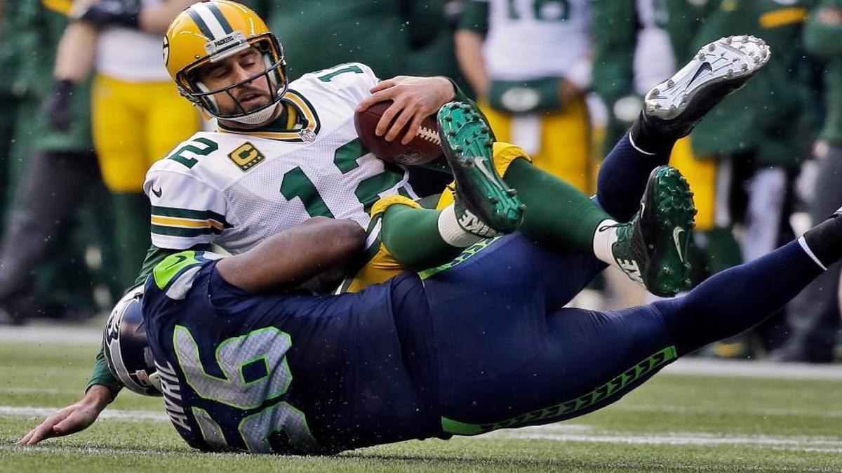 
Seahawks defensive end Cliff Avril sacks Packers quarterback Aaron Rodgers last January during the NFC Championship Game in Seattle. Rodgers has not played particularly well in three recent meetings against Seattle.
