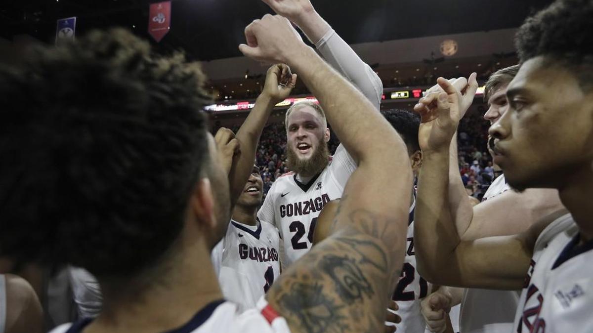 Gonzaga's Przemek Karnowski, center, celebrates with teammates after defeating Saint Mary's in the championship of the West Coast Conference tournament on March 7 in Las Vegas. Gonzaga won 74-56.