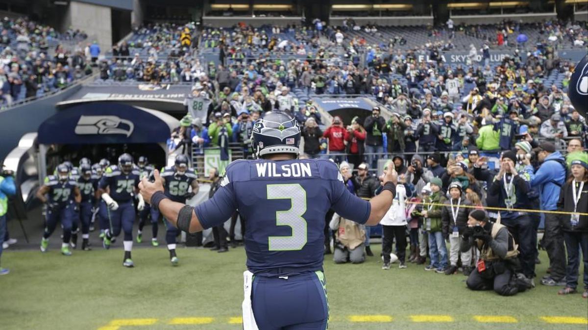 Seahawks quarterback Russell Wilson waits for teammates to run out of the tunnel Sunday. Wilson has been at the forefront of what appears to be a reawakening of the offense.