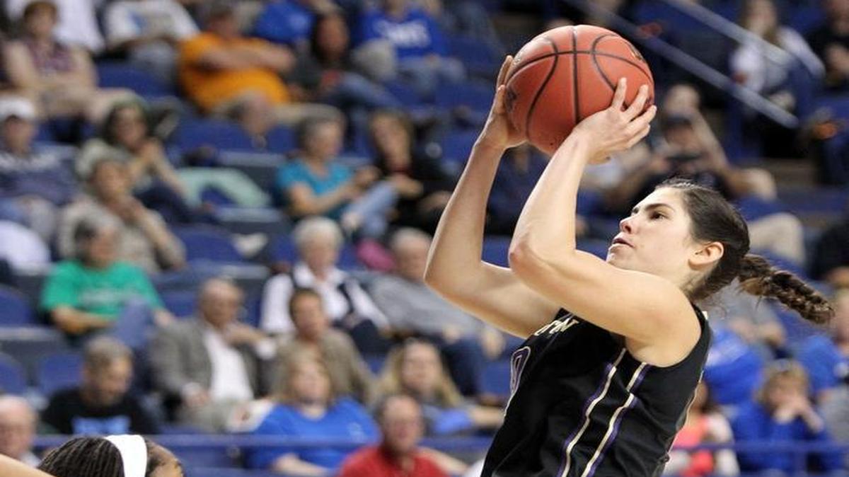 Washington’s Kelsey Plum, right, shoots while defended by Stanford’s Lili Thompson during the Huskies’ win in the regional final this past Sunday in Lexington, Ky.