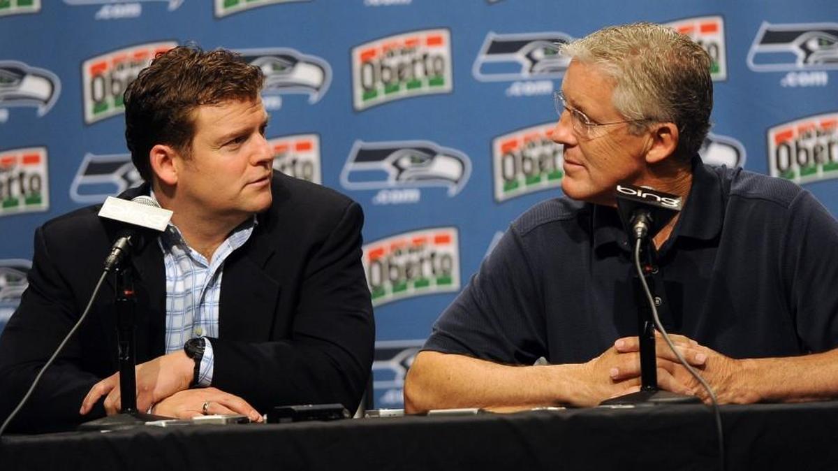 Of the 56 draft picks made by the tandem of Seahawks general manager John Schneider, left, and coach Pete Carroll, 42 are still playing in the NFL.