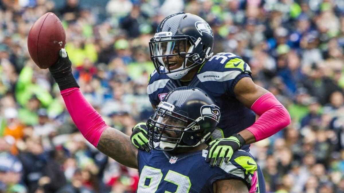 Seahawks defensive lineman Tony McDaniel and teammate DeShawn Shead celebrate McDaniel’s fumble recovery Oct. 16 during Seattle’s 26-24 win over the Atlanta Falcons in Seattle.
