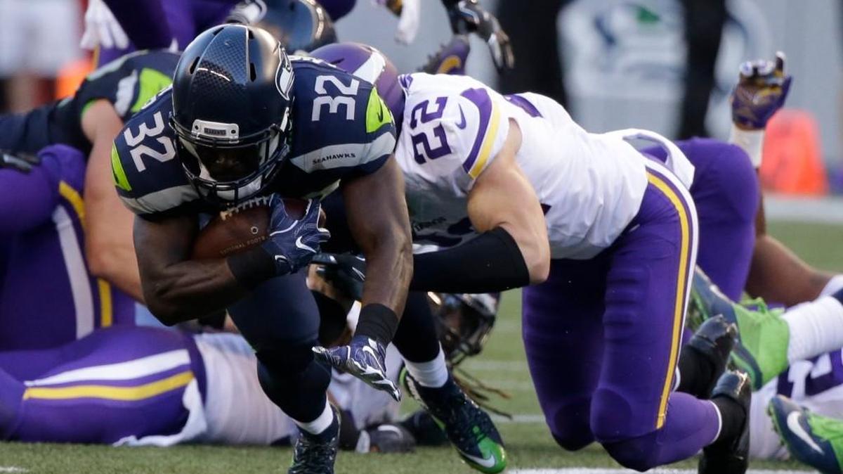 Seahawks running back Christine Michael is tackled by Minnesota Vikings safety Harrison Smith (22) during the first half of an exhibition game Aug. 18.