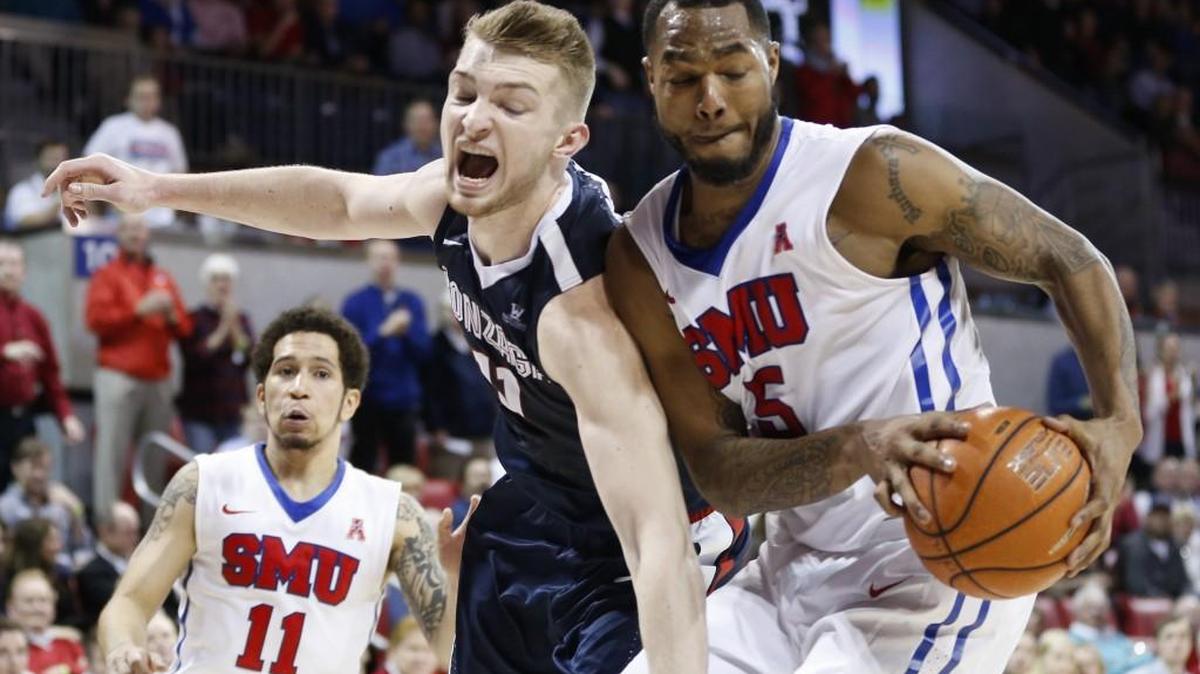 SMU forward Markus Kennedy (5) pulls in a rebound against Gonzaga forward Domantas Sabonis (11) during the second half of an NCAA college basketball game, Saturday, Feb. 13, 2016, in Dallas. SMU won 69-60.