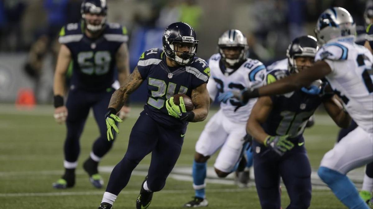 Seahawks wide receiver Tyler Lockett (16) blocks downfield as running back Thomas Rawls (34) breaks free on a touchdown run against the Carolina Panthers on Dec. 4 in Seattle.
