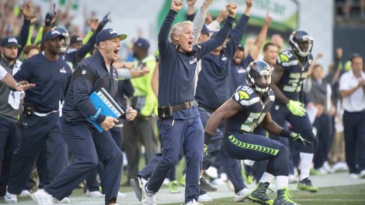 Seattle coach Pete Carroll and the Seahawks’ sideline celebrates as Cassius Marsh blocks a Miami field goal attempt during the opening week of the NFL season. With the playoffs beginning this week, the Seahawks need to find their stride quickly.