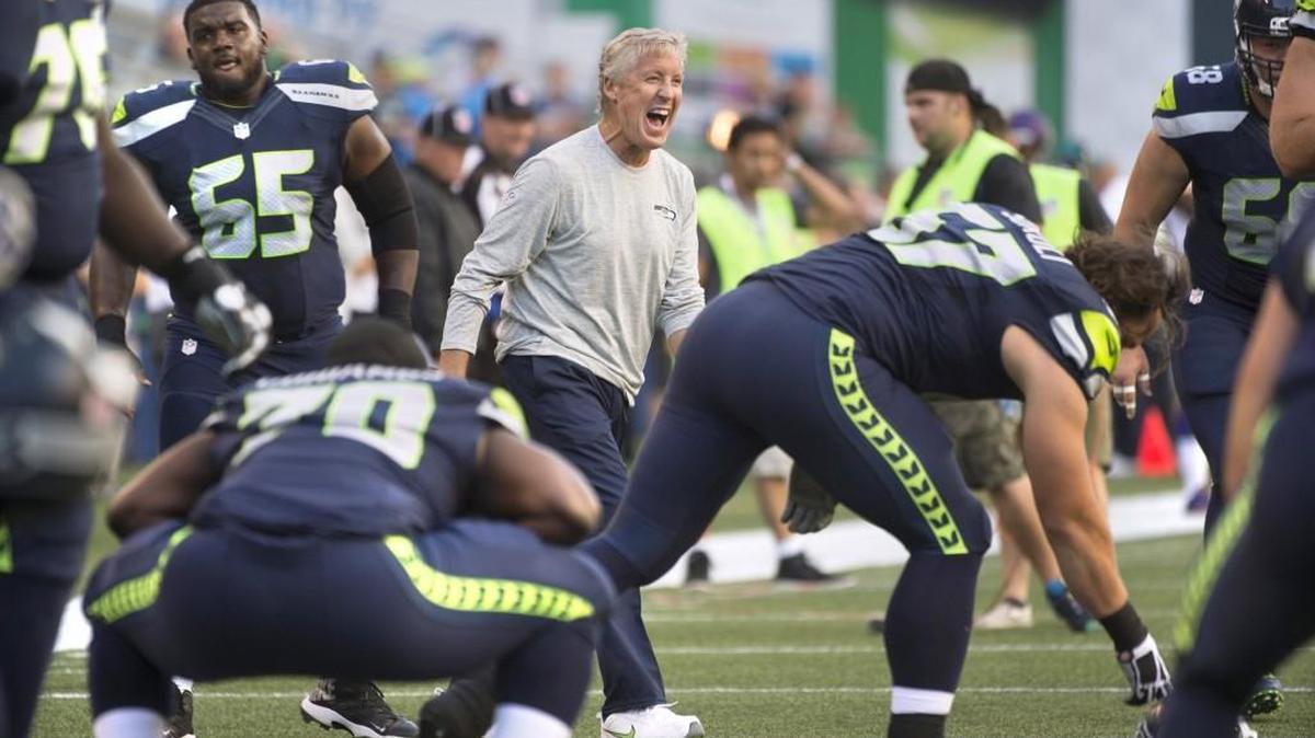 Seattle Seahawks head coach Pete Carroll lets out a laugh as he jokes around with players during warmups before a preseason game against Minnesota this past month.