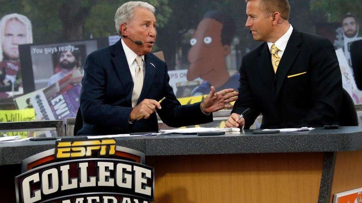 ESPN College GameDay hosts Lee Corso, left, and Kirk Herbstreit confer prior to an Auburn-Mississippi game in Starkville, Miss. If you think Corso is a wild personality on TV, you should have seen him as a coach.