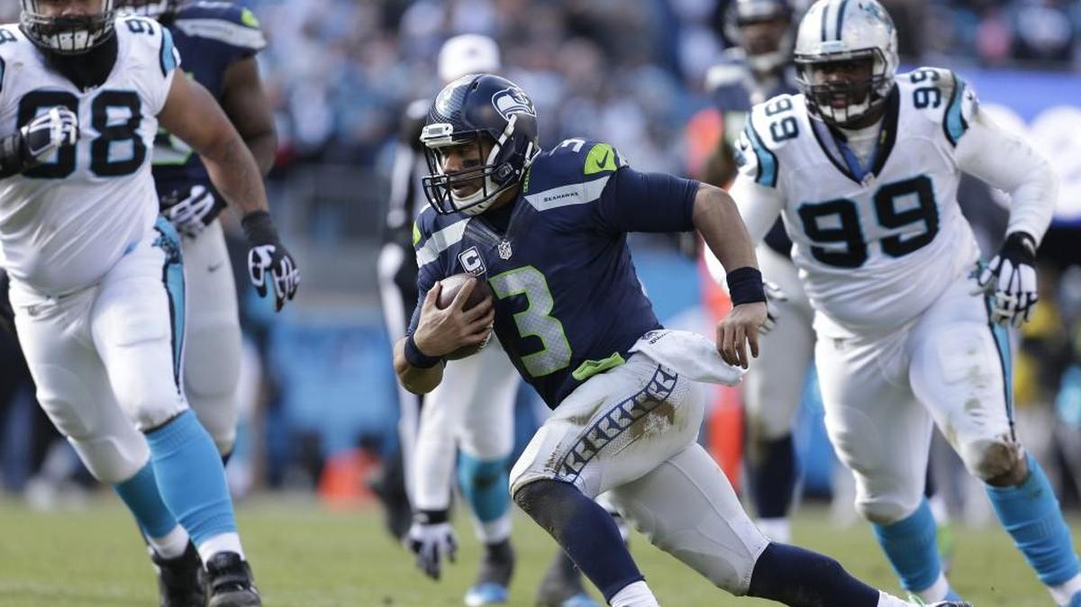 Seattle’s Russell Wilson (3) attempts to evade Carolina’s defense during the first half of the NFL divisional playoff game on Sunday. Despite the early exit from this year’s playoffs, the Seahawks’ future looks bright with Wilson improving every year while still entering his prime.