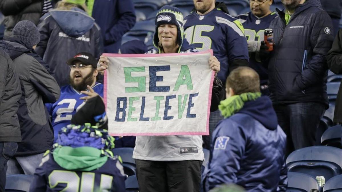 A Seattle Seahawks fan holds a sign that reads “Sea Believe” at the end of the Seahawks’ 26-6 victory over the Detroit Lions in an NFC wild card game last week. A victory over the Atlanta Falcons would say something about the Seahawks’ outlook going forward.