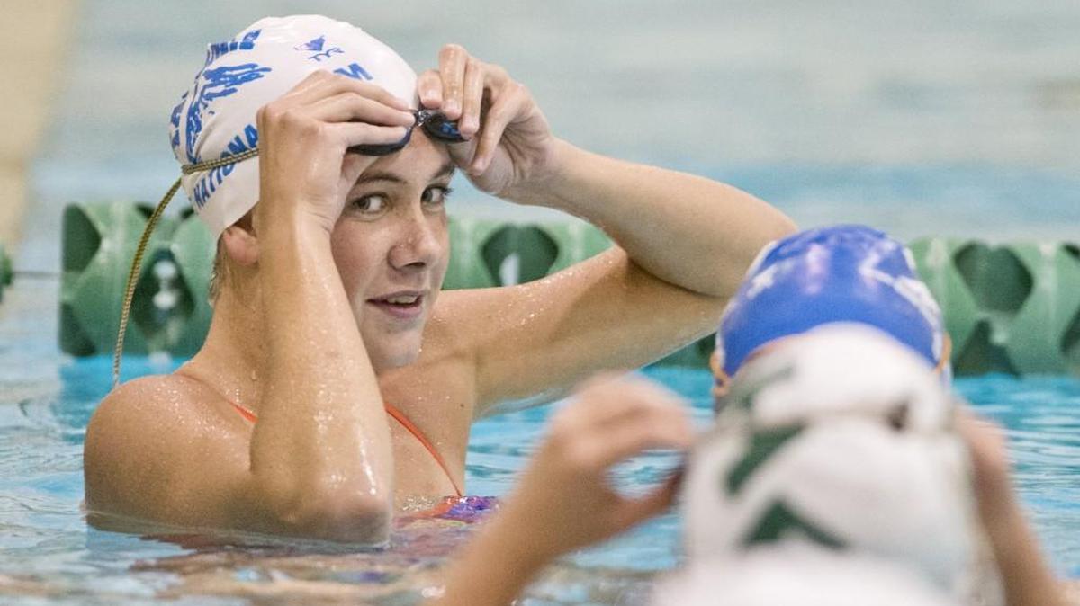Emma Chard and teammates take a break during swim practice at Foss High School in 2013.