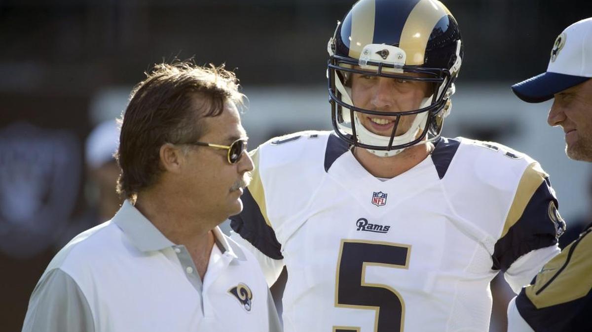 
Rams coach Jeff Fisher, left, expects big things from new St. Louis quarterback Nick Foles. The Rams traded oft-injured QB Sam Bradford, the No. 1 overall pick in 2010, to Philadelphia for Foles, who starred at the University of Arizona.
