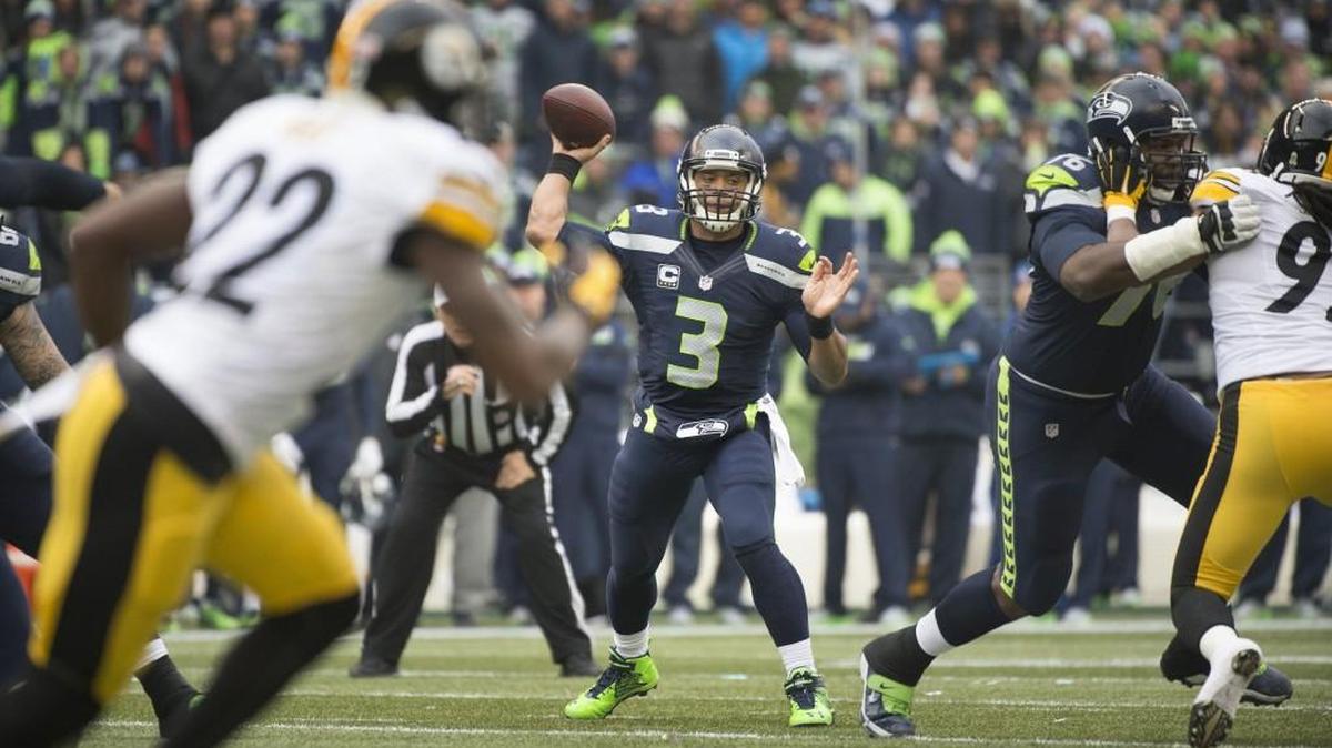 Seahawks quarterback Russell Wilson fires a pass against the Steelers. Wilson finished 21 of 30 and 345 passing yards with five touchdowns.