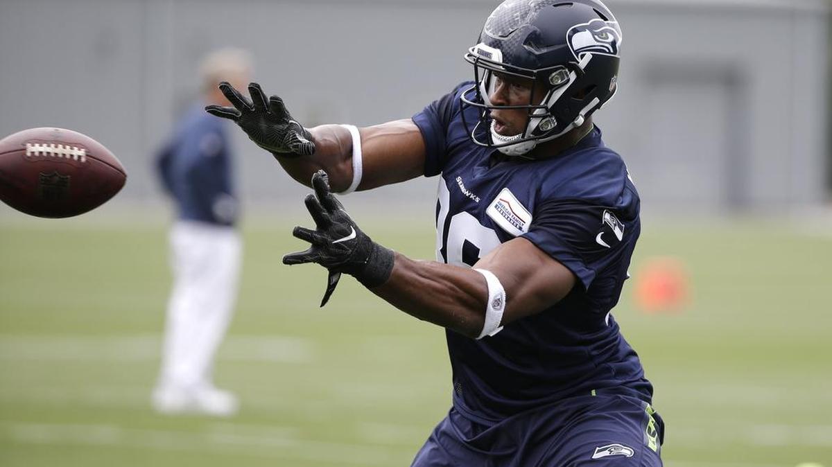 Seattle Seahawks' Brandon Williams reaches for a pass during the team's NFL football training camp Saturday, July 30, 2016, in Renton.