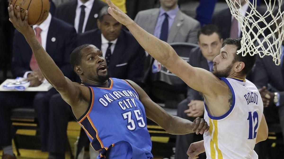 Oklahoma City Thunder forward Kevin Durant, left, announced Monday that he will sign with the Golden State Warriors.