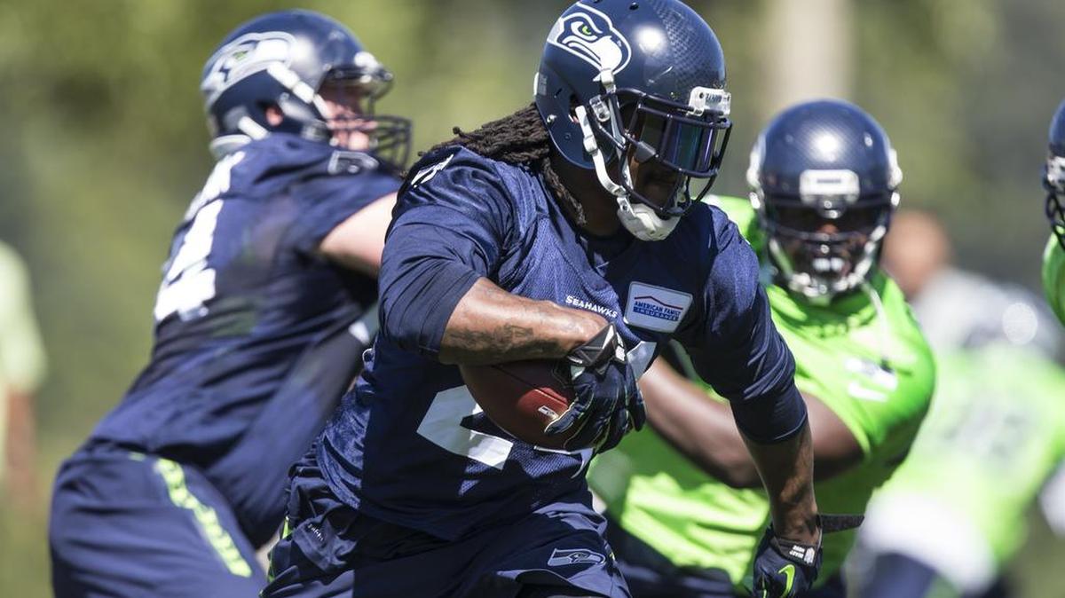 
Veteran running back Marshawn Lynch, carrying the football during training camp last week, has not been a distraction this season for the Seahawks.
