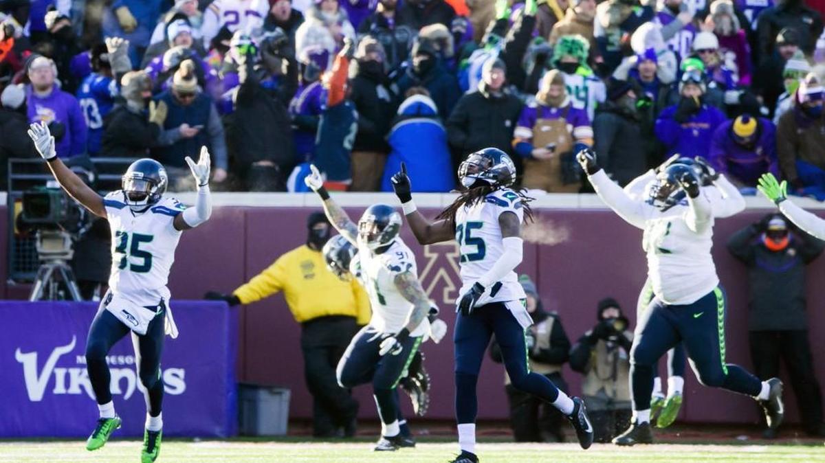 Seahawks players, including Richard Sherman (25) and Deshawn Shead (35), celebrate Sunday after Vikings kicker Blair Walsh missed a late field goal, sealing Seattle’s 10-9 victory over Minnesota at TCF Bank Stadium in Minneapolis.