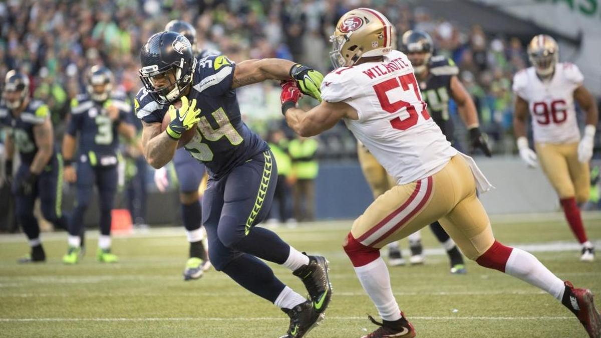 Seahawks running back Thomas Rawls breaks away from 49ers linebacker Michael Wilhoite for a touchdown reception Sunday. Rawls racked up more than 250 yards from scrimmage, giving the Seahawks offense hope despite the injury to Marshawn Lynch.