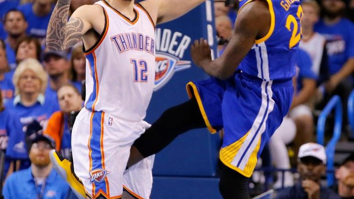 Golden State’s Draymond Green kicks between the legs of Oklahoma City’s Steven Adams (12) during Game 3 of the Western Conference NBA finals.