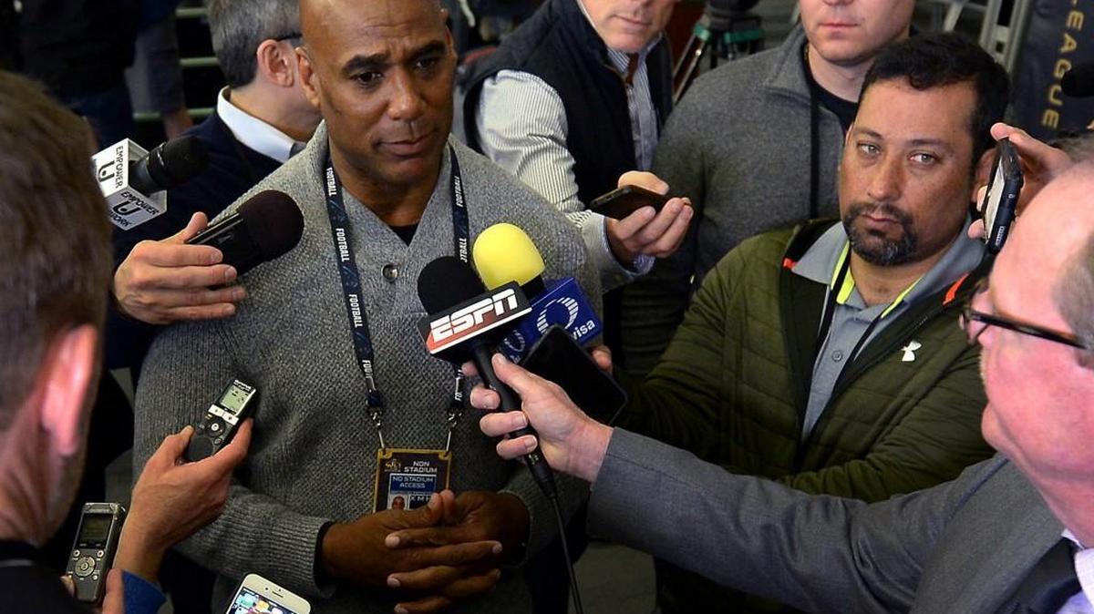 Carolina Panthers radio broadcast analyst Eugene Robinson, left, speaks with reporters following a news conference on Tuesday, Feb. 2, 2016, at the San Jose Convention Center. Robinson spoke to the team before they left Charlotte for San Francisco about the incident where he was arrested the night before Super Bowl XXXIII for soliciting prostitution in Miami.