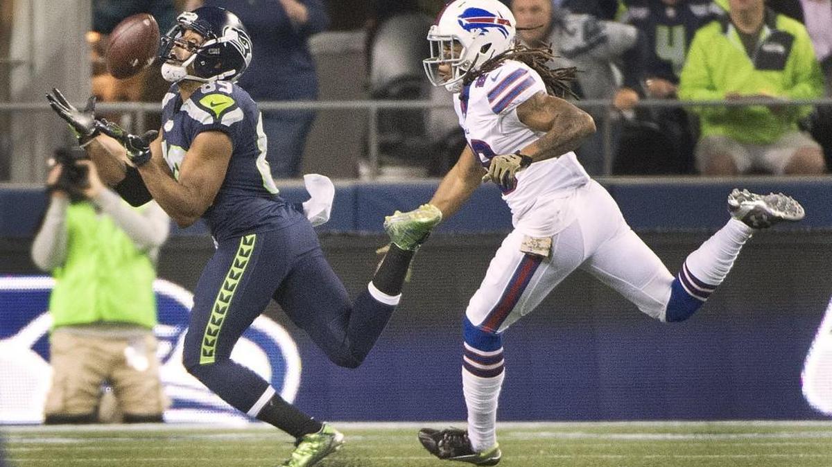 Seattle’s Doug Baldwin makes a catch as the Bills’ Ronald Darby defends Monday in the first quarter. The catch helped set up Seattle's first touchdown.