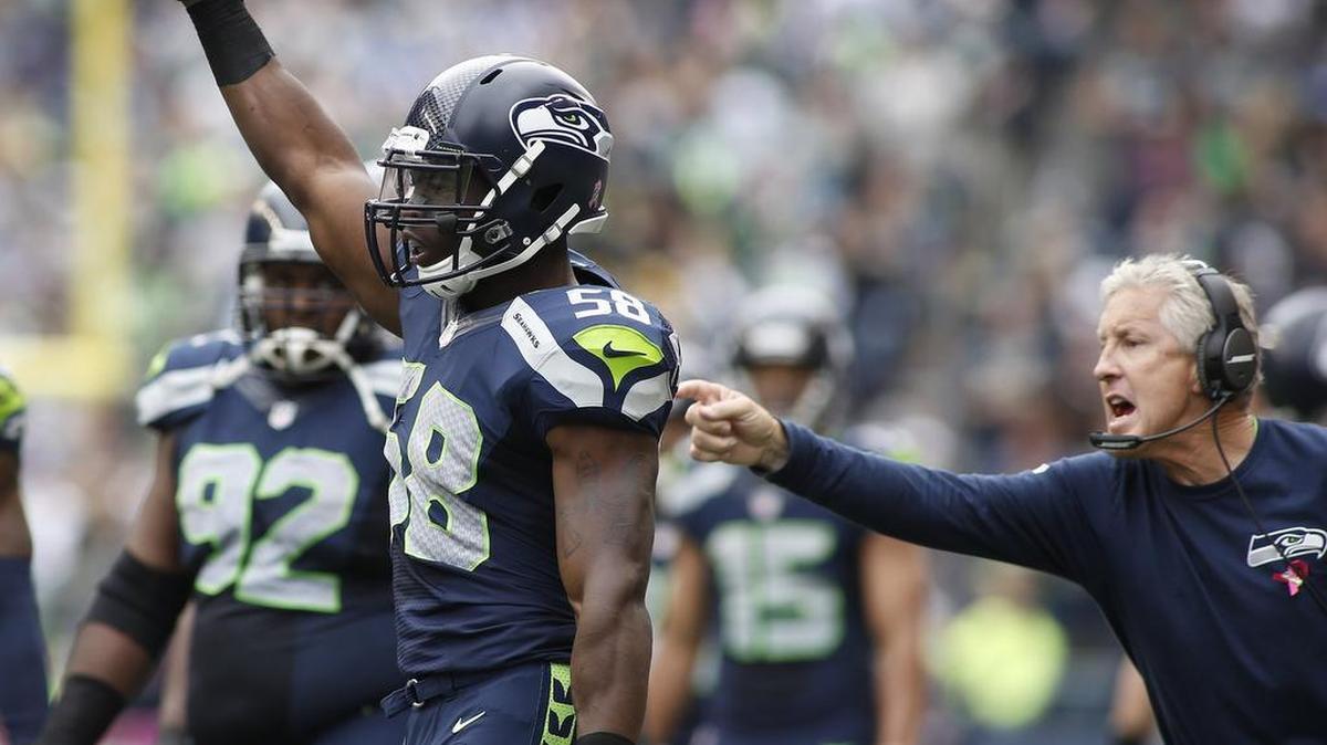 
Seahawks linebacker Kevin Pierre-Louis (58) has drawn praise from coach Pete Carroll, right.
