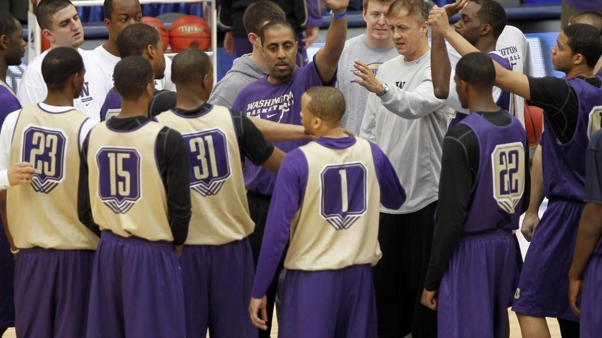 Washington head coach Lorenzo Romar, center, gathers his players before the Huskies’ game in the NCAA Tournament in 2010. Romar, who was fired Wednesday, has not been back in the tournament since.