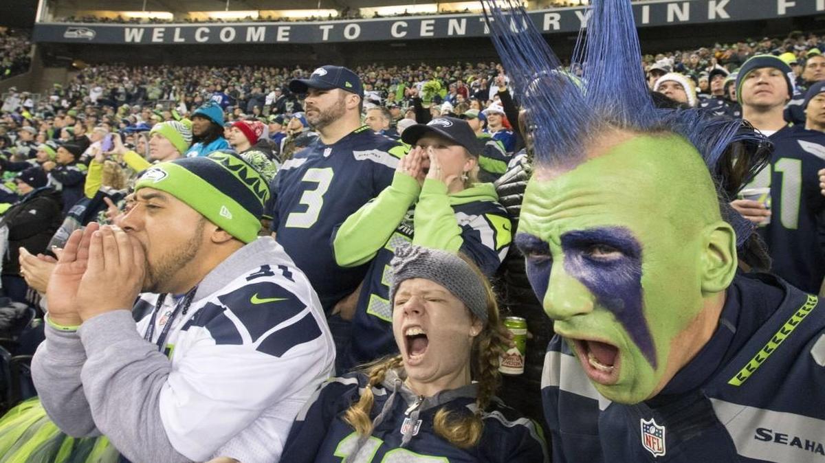 
Seahawks fans such as Justin Pelesasa, left, of Tacoma, Elisabeth Britton, formerly of Puyallup, and Phil Andruss of Tacoma, help give their favorite team a decided home-field advantage at CenturyLink Field.
