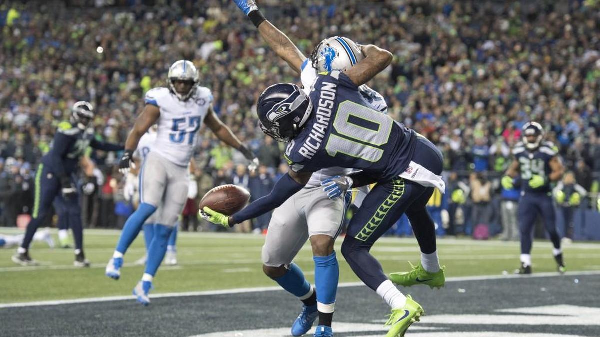 Seahawks receiver Paul Richardson makes a circus catch over Detroit safety Tavon Wilson to score a touchdown to put Seattle up 7-0 in the second quarter.
