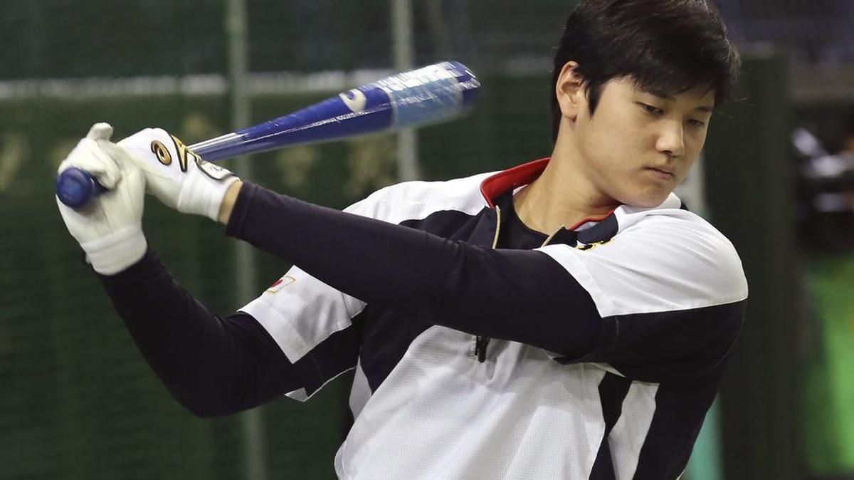 Shohei Otani swings during a team Japan batting practice in November. Otani plays the outfield, DHs and pitches.