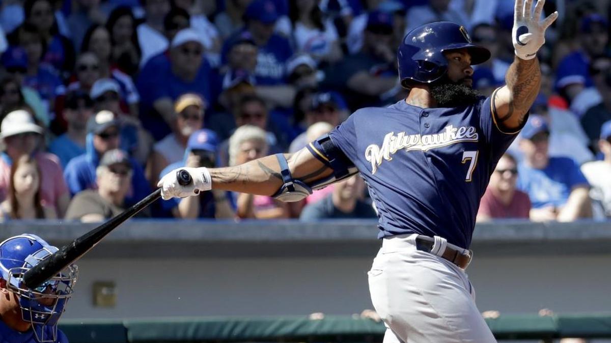 Milwaukee Brewers’ Eric Thames (7) hits against the Chicago Cubs during the first inning of a spring training baseball game on March 14 in Mesa, Ariz.