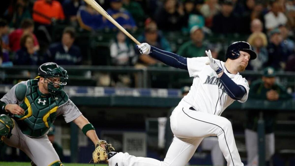 Seattle’s Adam Lind swings and misses as he strikes out to end the game Friday night in Seattle. Seattle managed five runs in three games this weekend — against the likes of Eric Surkamp, Rich Hill and Chris Bassitt — which does not bode well.