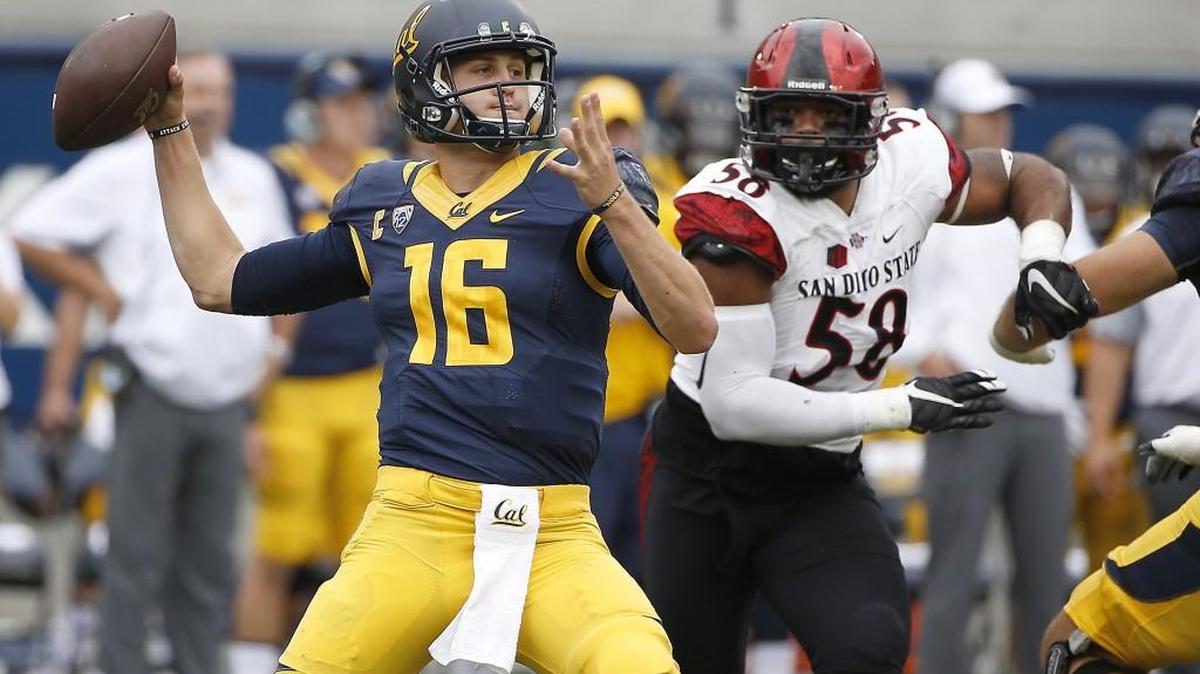 
California quarterback Jared Goff (16) passes under pressure by San Diego State defensive lineman Alex Barrett (58) during the first half of an NCAA college football game Saturday, Sept. 12, 2015, in Berkeley, Calif.
