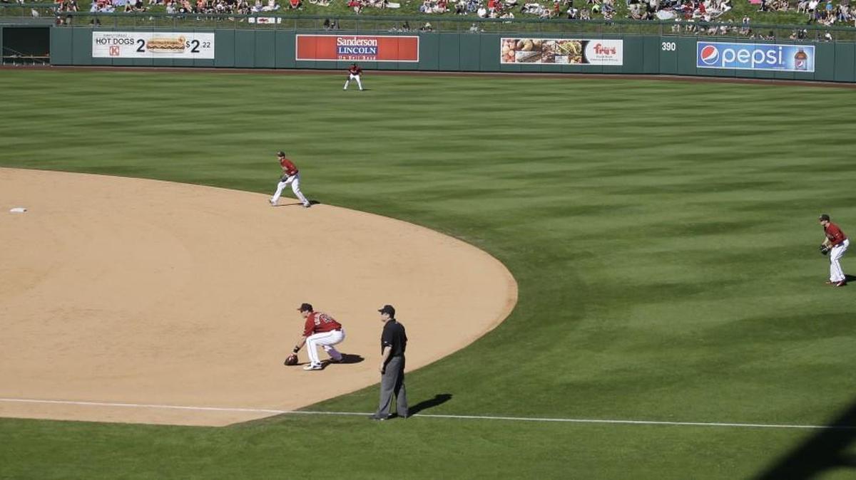 Diamondbacks shortstop Nick Ahmed, second baseman Brandon Drury, right, and first baseman Paul Goldschmidt, near, overload one side of the infield against Oakland during a spring training game in Scottsdale, Ariz. The defensive shift, while not particularly fan-friendly, is gaining popularity.