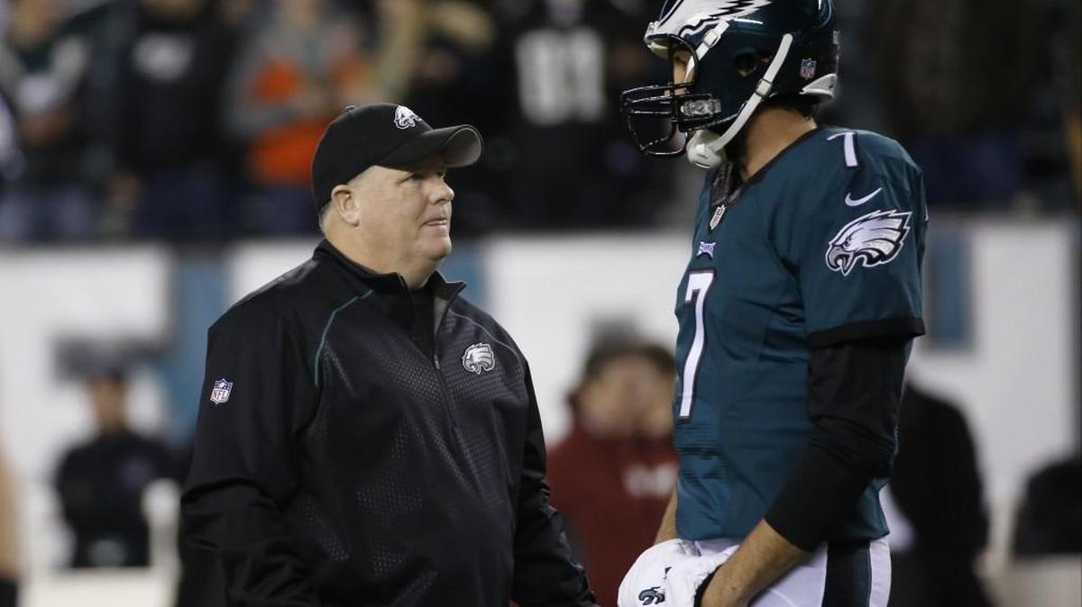Philadelphia Eagles coach Chip Kelly, left, meets with quarterback Sam Bradford before a game against Washington on Dec. 26. Kelly was fired three days later.