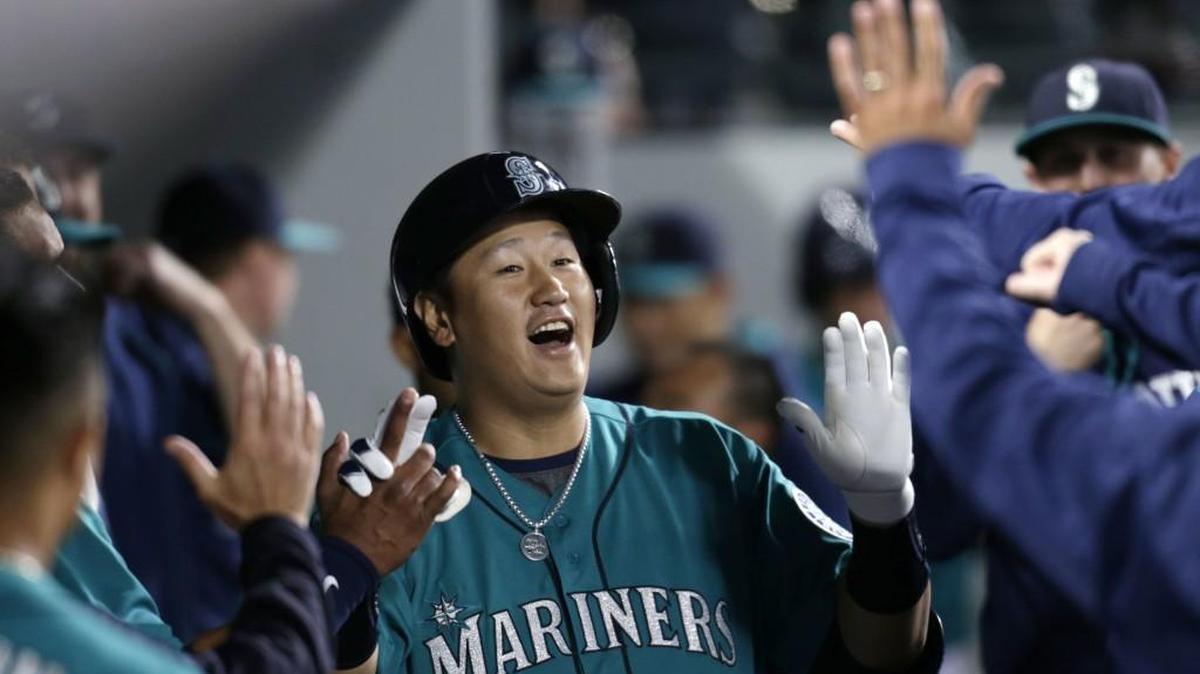 Dae-Ho Lee is congratulated in the dugout after hitting a home run against Texas on June 10. Playing only part time, Lee struggled at the plate in the second half of the season and was sent down to Tacoma to regain his hitting form.