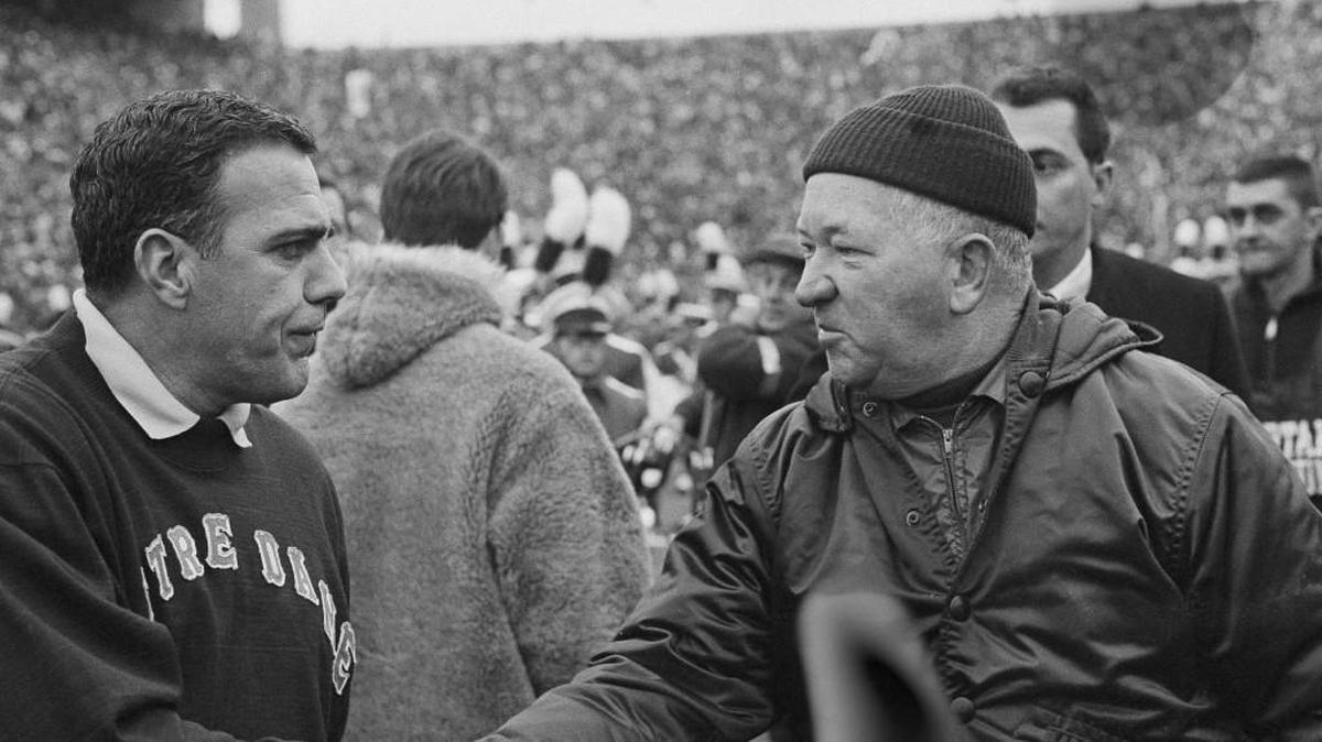 Notre Dame football coach Ara Parseghian, left, shakes hands with Michigan State coach Duffy Daugherty after their 10-10 tie, Nov. 19, 1966, in East Lansing, Mich.