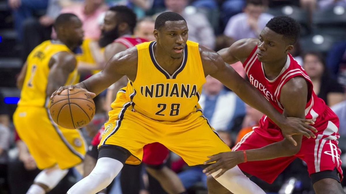 FILE - In this March 27, 2016, file photo, Indiana Pacers center Ian Mahinmi (28) works against Houston Rockets forward Clint Capela during an NBA basketball game in Indianapolis.